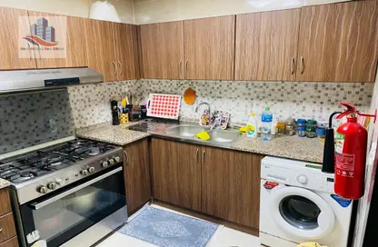 Kitchen image for: Apartment - 1 Bedroom - 2 Bathrooms for rent in New Al Taawun Road - Al Taawun - Sharjah, Image 1