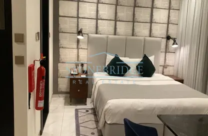 صورة لـ غرفة- غرفة النوم النزل و الشقق الفندقية - 1 حمام للبيع في ميلينيوم اتريا بزنس باي - الخليج التجاري - دبي ، صورة رقم 1
