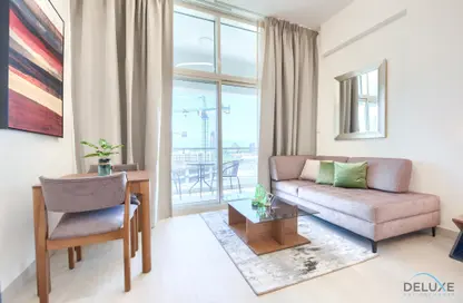 Living Room image for: Apartment - 1 Bathroom for rent in Azizi Aliyah - Dubai Healthcare City - Dubai, Image 1